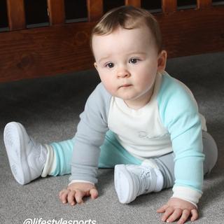 My little boy showing off his cool new trainers for his 1st birthday