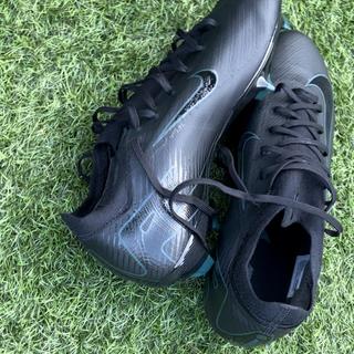 The colour of the swoosh and the studs